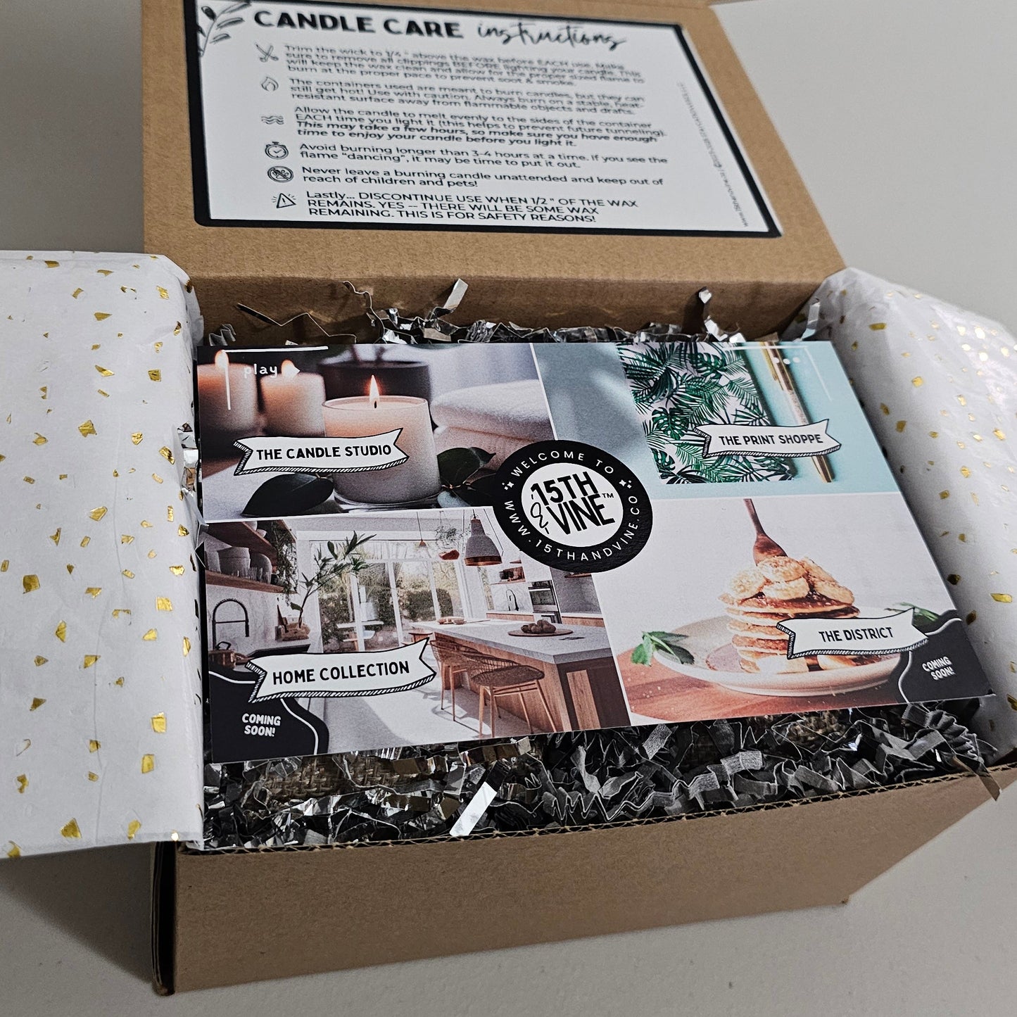 Unopened candle packaging with brand logo on a plain background