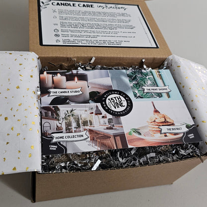 Unopened candle packaging with brand logo on a plain background